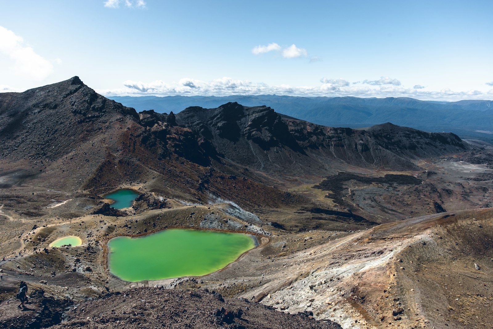The green Emerald Lakes amid the volcanic terrain of Tongariro National Park on the Central Plateau, on the State Highway 1 route from Auckland to Wellington